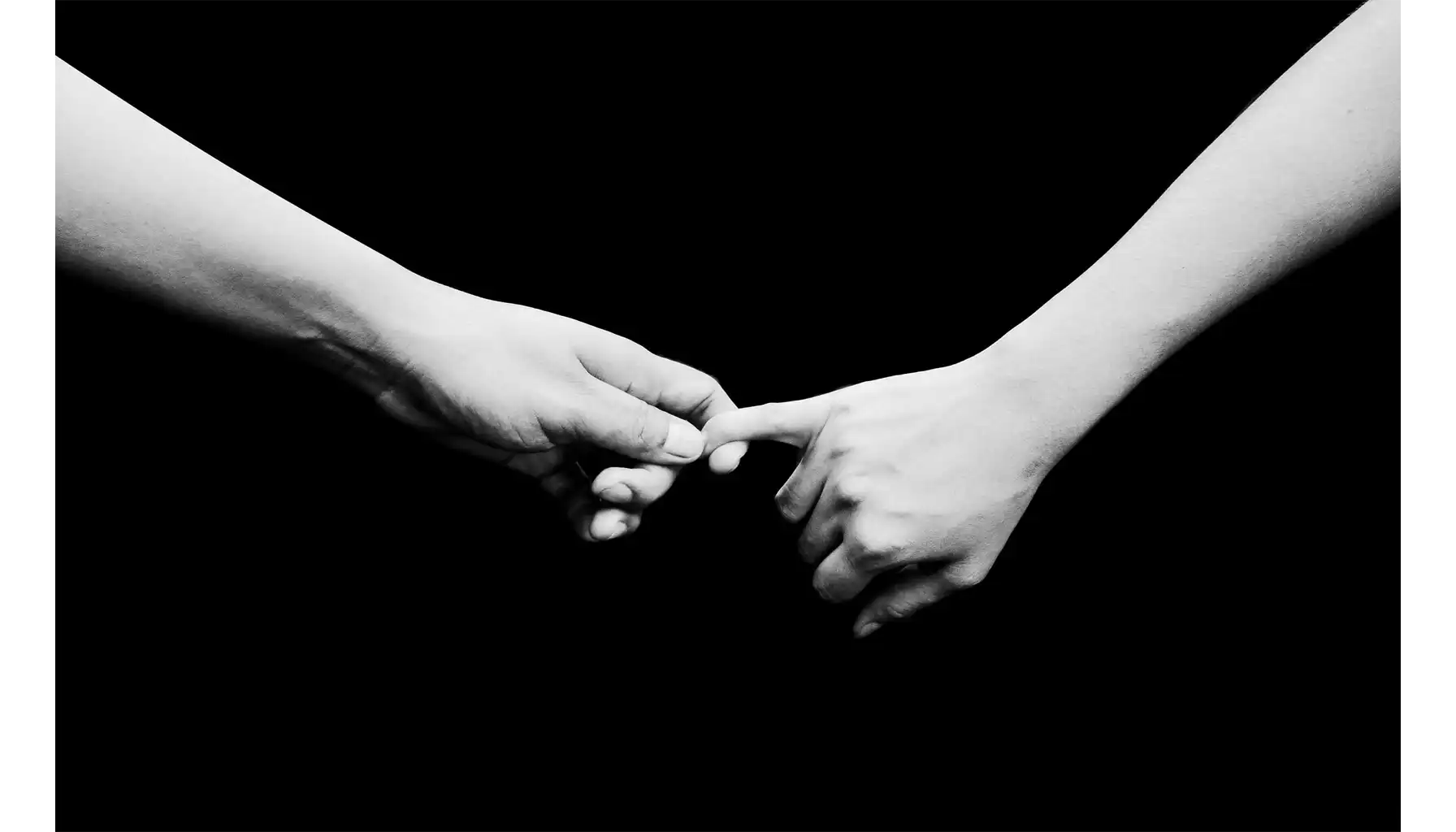 one hand holds the other by the finger